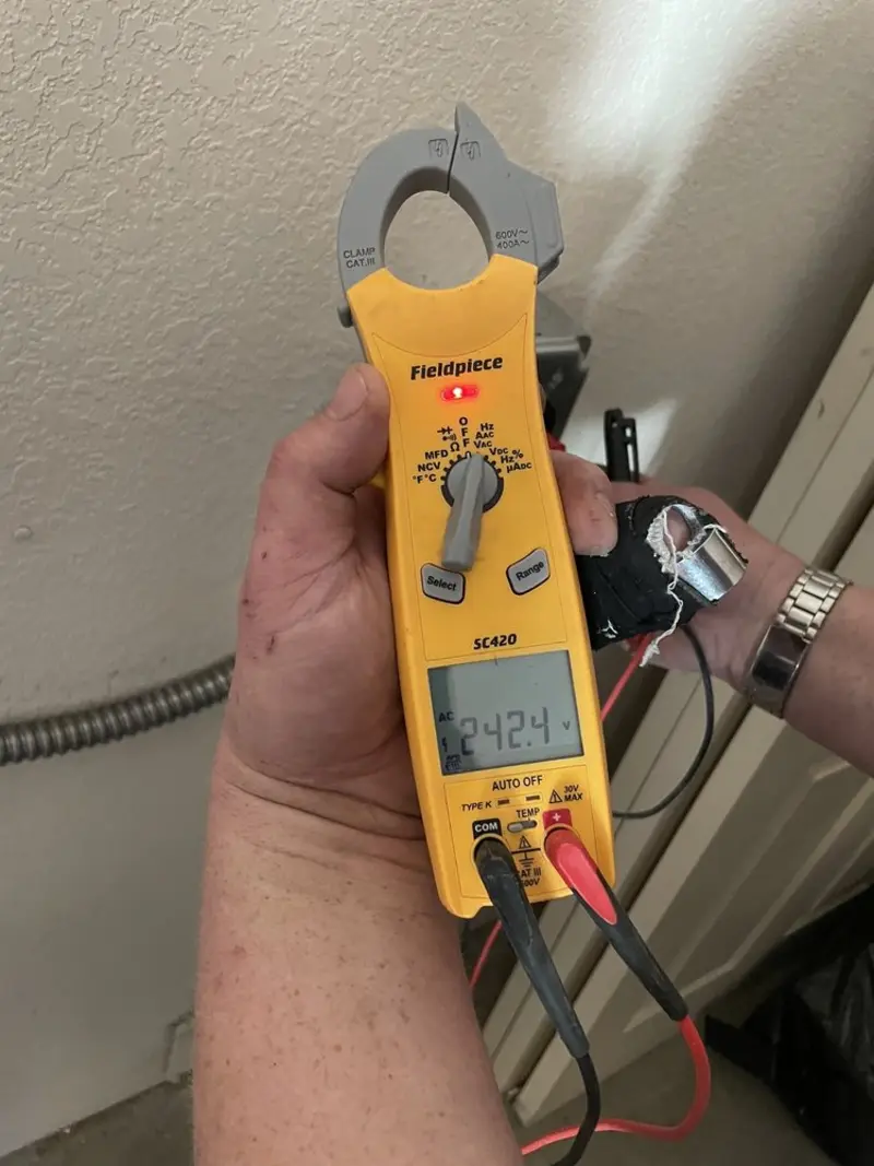 Voltage testing with clamp meter during Recessed Lighting Installation in Palm Beach